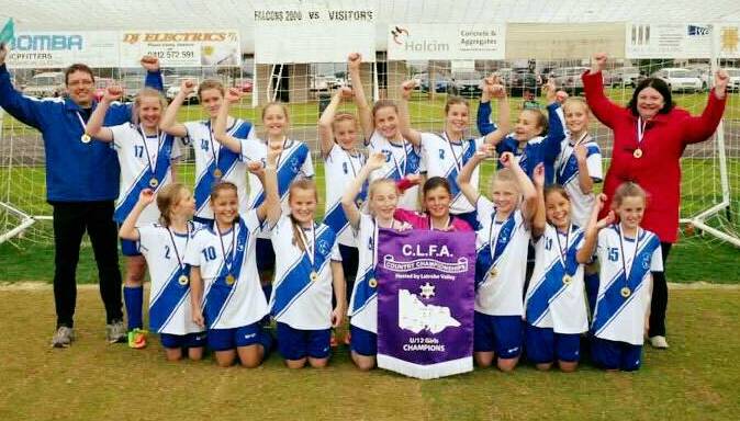 CHAMPIONS: Ballarat and District Soccer Association's under-12 squad celebrated its grand final victory over Albury-Wodonga in the Country Championships. 