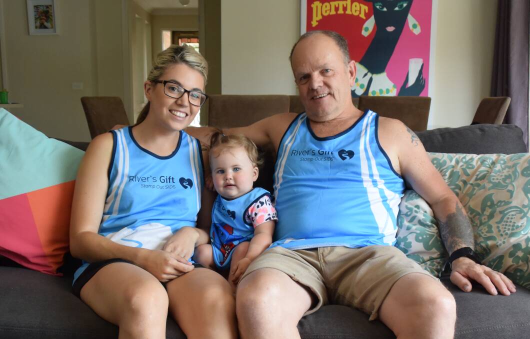FAMILY SUPPORT: Jess Lang, daughter Ava Rutherford and father Shane Lang are raising money for SIDS research. Picture: Siobhan Calafiore