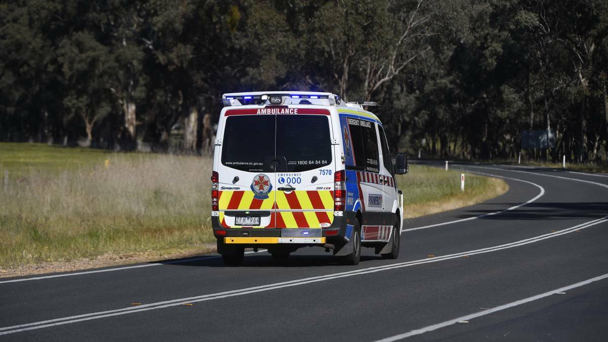 An ambulance leaving the scene of a bus crash just outside of Avoca on Saturday. Picture: Luka Kauzlaric
