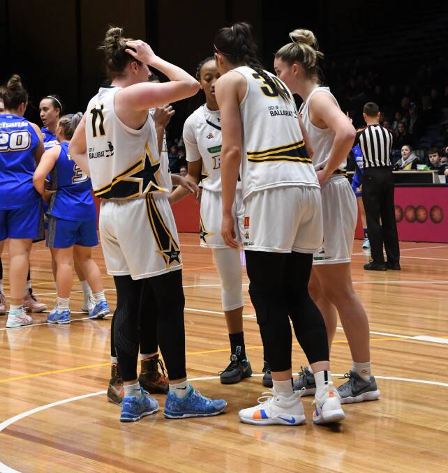 CHALLENGED: Ballarat Rush regroups on court at Bendigo Stadium for Wednesday night's clash against the Braves. Kelly Wilson starred for the Braves falling just short of a triple-double and top scoring with 23 points. Picture: Luke West 