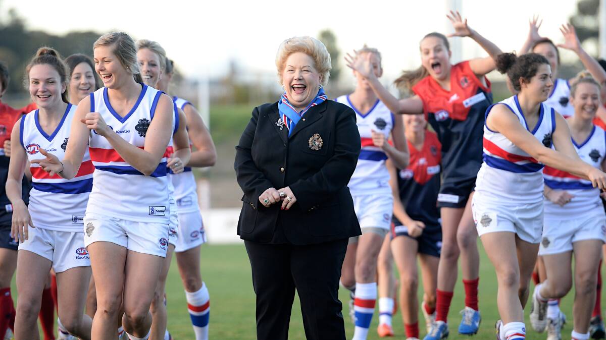 Susan Alberti with the women's football teams. Picture: Pat Scala
