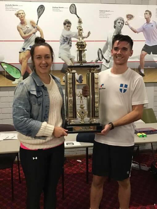 SUCCESS: Taylor Flavell and Steven London share the spoils of victory as the respective Ballarat Open women's and men's champions. Picture: Ballarat Squash and Racquetball Association/Facebook.