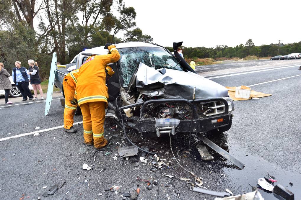 Highway closed: Emergency service members at the scene of the fatality near Smythesdale. PICTURE: JEREMY BANNISTER
