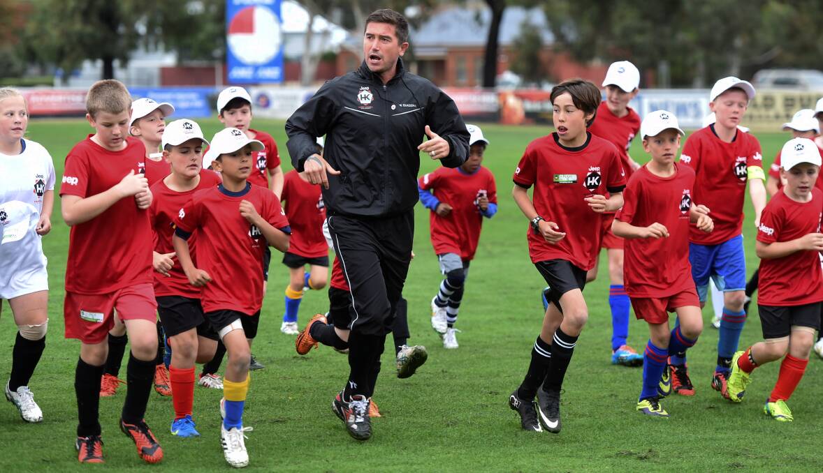Royalty: Harry Kewell takes some young players through a drill at Trekardo Park. PICTURE: LACHLAN BENCE