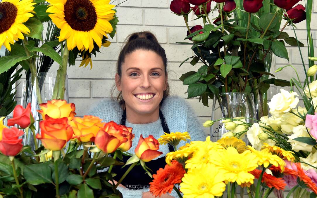 Blooming: Ballarat apprentice florist Kaitlyn Schiltz won a floral arranging category at the Melbourne International Flower and Garden Show. PICTURE: JEREMY BANNISTER