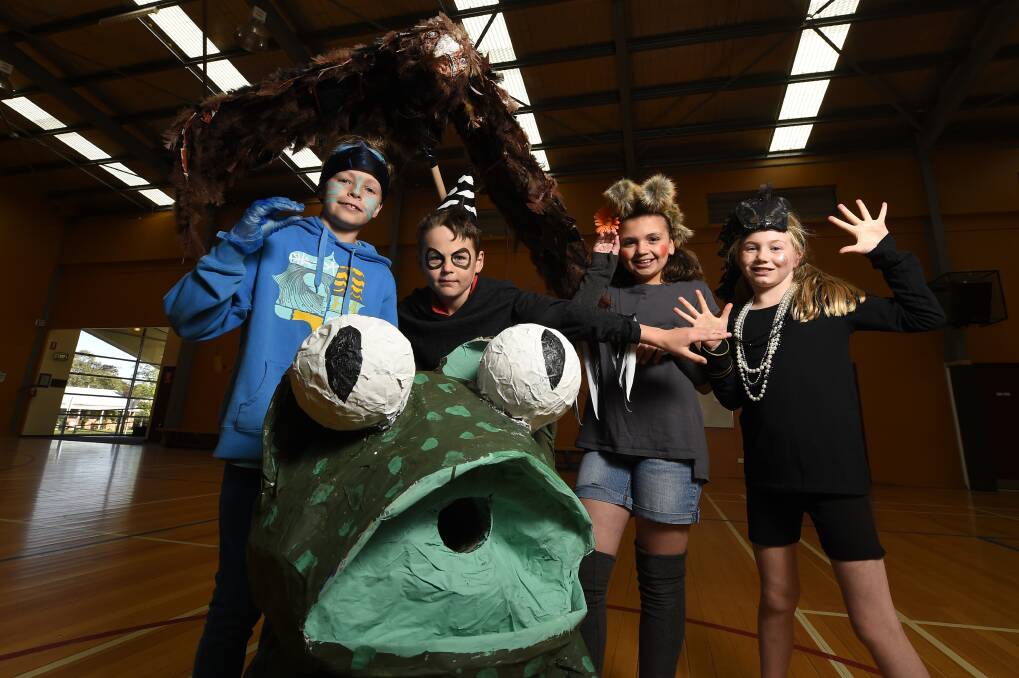Play it again: Buninyong Primary School pupils Connor Brisbane, 10, Josh Matheson, 9, Amy Wells, 10, and Tam Petrov, 10, join in the frog action. PICTURE: JUSTIN WHITELOCK