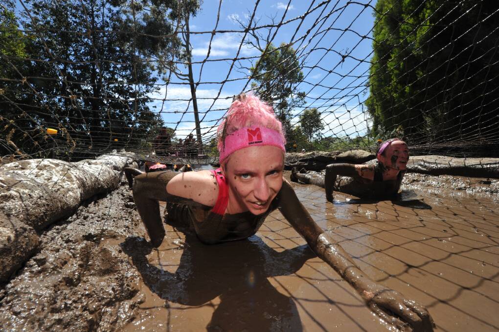 Here’s mud in your eye: Alex Standen, of Gippsland, competes in the Miss Muddy event at Creswick. PICTURE: JEREMY BANNISTER