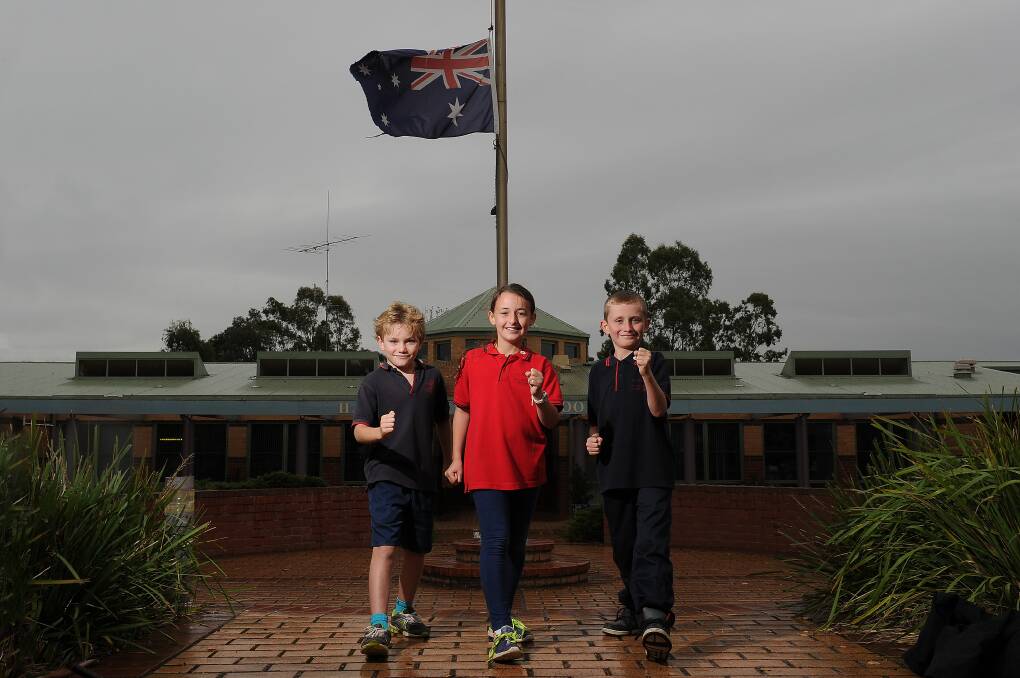TROOPERS: Beau, Jorja and Deegan have been among the Haddon Primary School pupils chalking up the kilometres in the Run to Gallipoli project. Through various activities, the school community is travelling the same distance Anzac soldiers had to take to reach Gallipoli. PICTURE: JUSTIN WHITELOCK