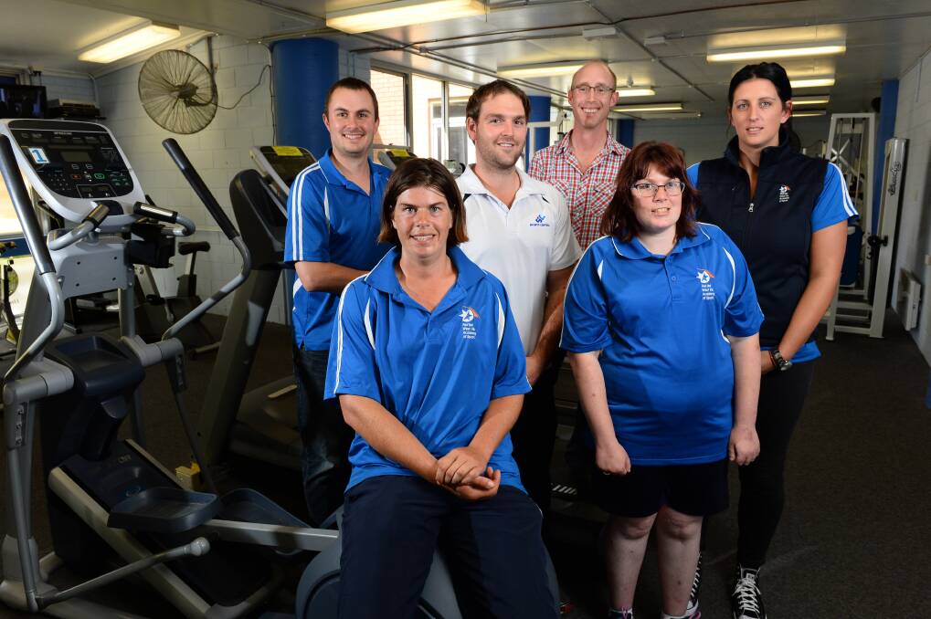 Standing together: WestVic Academy of Sport executive Rob Ward, left, with athlete Marion McKenzie, Sports Central project co-ordinator Lachlan Smith, Special Olympics Ballarat chairman Stuart Bates, athlete Kellie Hughes and WestVic academy sports programs manager Kelly Dunn.
PICTURE: ADAM TRAFFORD