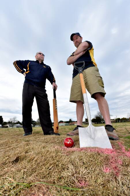 Upgrade: East Ballarat Cricket Club life members Damian Ryan and Jeremy Collier are glad to see works start on the new turf wicket at Russell Square. PICTURE: JEREMY BANNISTER
