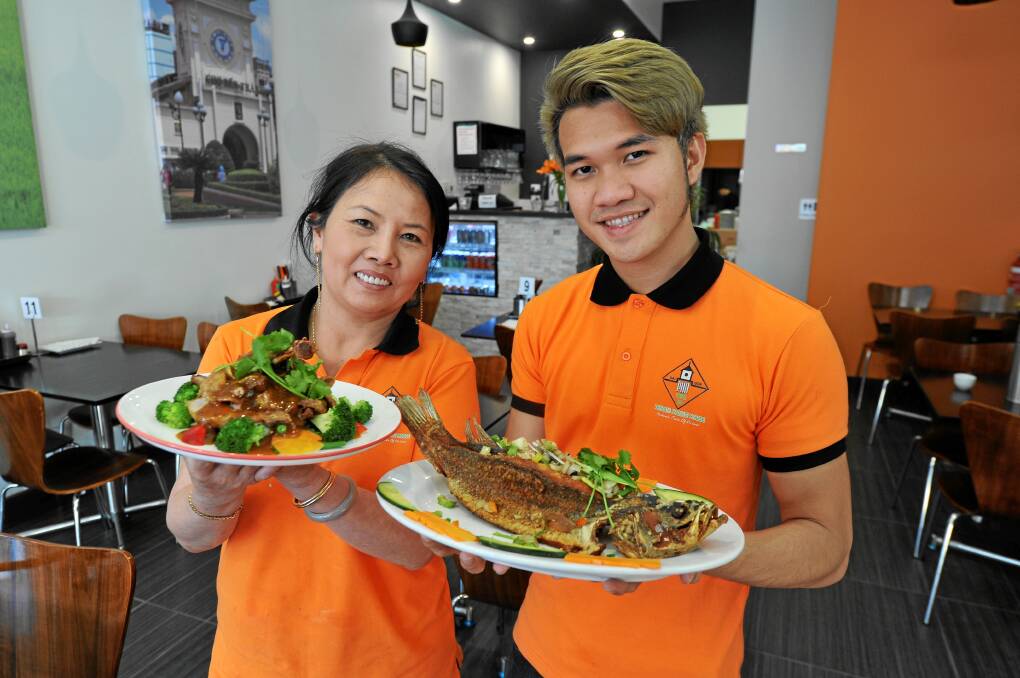 Open for business: Saigon Vietnam Noodle House has opened its doors in Armstrong Street North and Hung Ho and Alvin Truong display some of the new restaurant’s dishes. PICTURE: LACHLAN BENCE