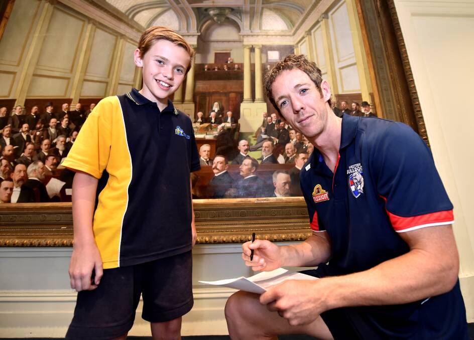 Welcome: Black Hill Primary School grade 6 pupil Jack Hillas gets an autograph from Bulldogs captain Bob Murphy. PICTURE: JEREMY BANNISTER