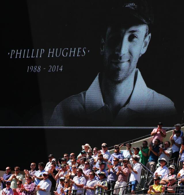 The crowd at the Adelaide Oval applauds Phillip Hughes for 63 minutes at the start of the First Test this week.