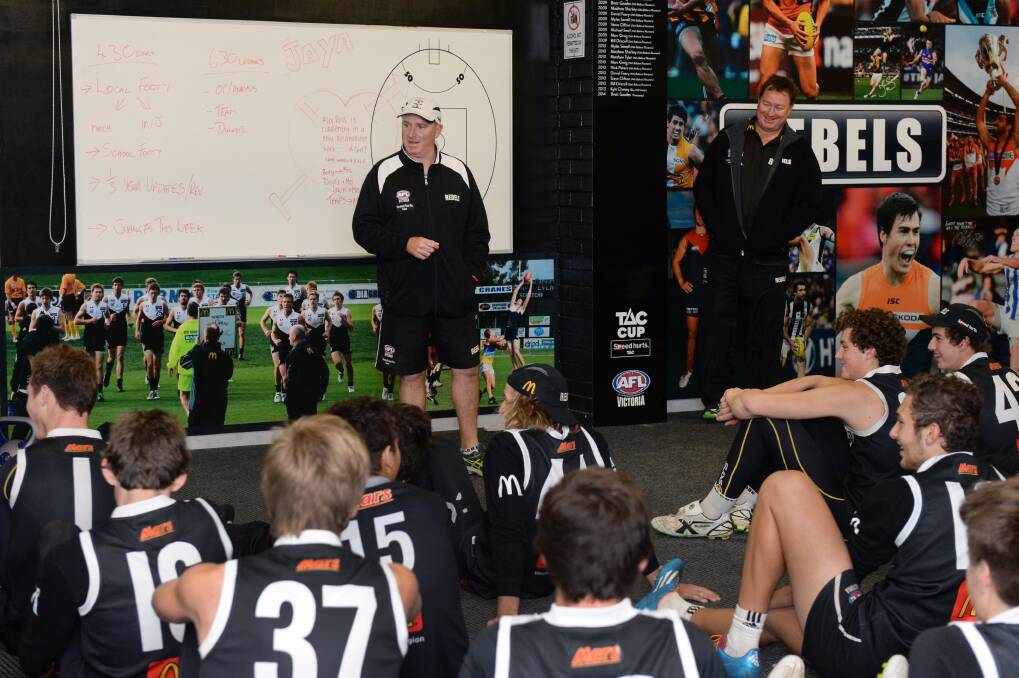 Going to plan: Rebels coach David Loader runs through playing strategies with the team. PICTURE: KATE HEALY