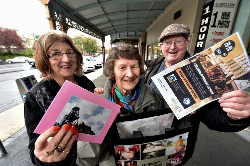 Convention: Ballarat Camera Club member Lorraine Harvey, YMCA Camera Club member Judy Johnson and Phillip Island Camera Club member Bob McKay are looking forward to the photography exhibition at FedUni on Saturday. PICTURE: JEREMY BANNISTER