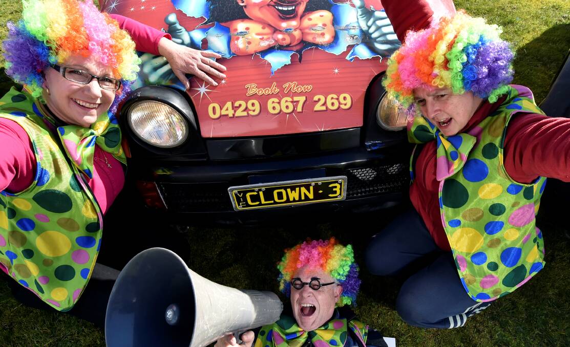 Clowning around: Ballarat Agricultural and Pastoral Society director Gerard Ballinger, surrounded by circus members Sandra Goulter and Linda Asher, gets set for The Great Moscow Circus which hits town next week. PICTURE: JEREMY BANNISTER