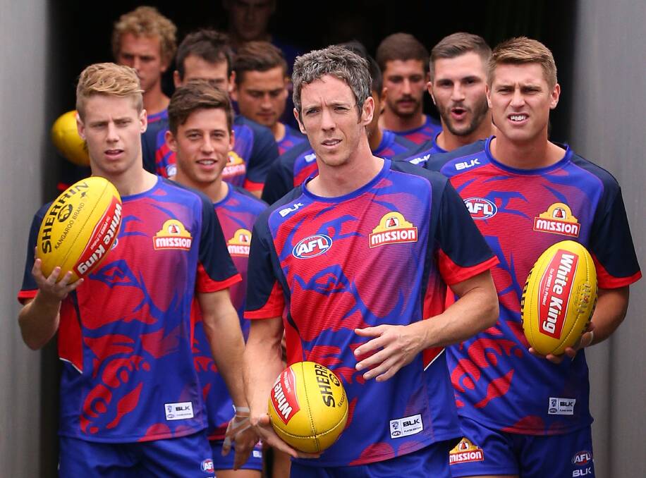Robert Murphy of the Bulldogs leads the team out for warm up during the NAB Challenge AFL match against Richmond on Saturday. PICTURE: Getty Images
