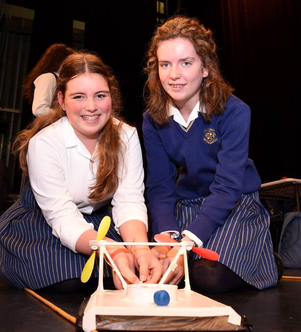 Sure to work: Loreto College students Emily Tabb and Imogen Noone work on their hovercraft. PICTURE: LACHLAN BENCE
