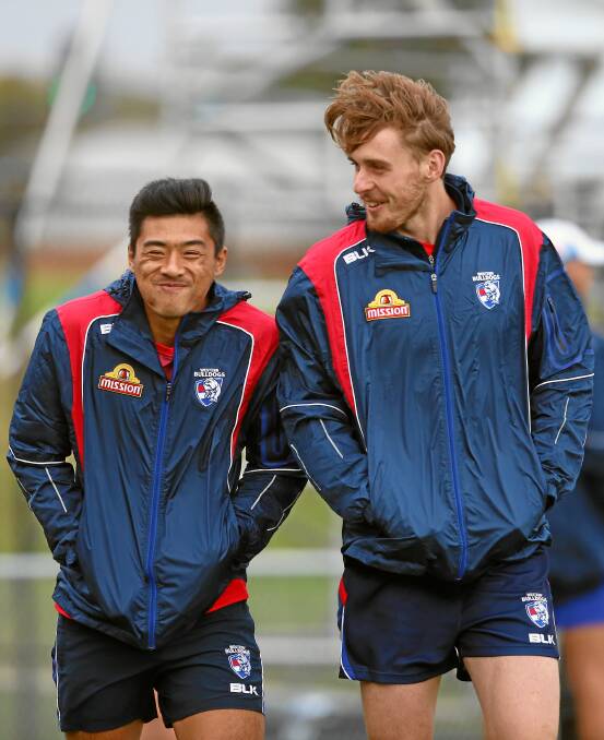 CHARACTER: Bulldog Lin Jong’s calm response to racist remarks when playing against Richmond last week showed him to be a man of understanding with a desire to promote change, writes Jordan Roughead. Jong is pictured with Roughead, and inset. 
PICTURES: GETTY IMAGES.