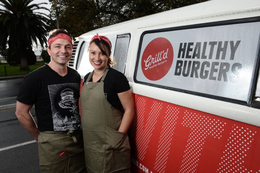 NEW FOOD: Ballarat Grill’d franchise partners Aaron Bones and Marietta Thompson in front of the restaurant’s van. PICTURE: ADAM TRAFFORD
