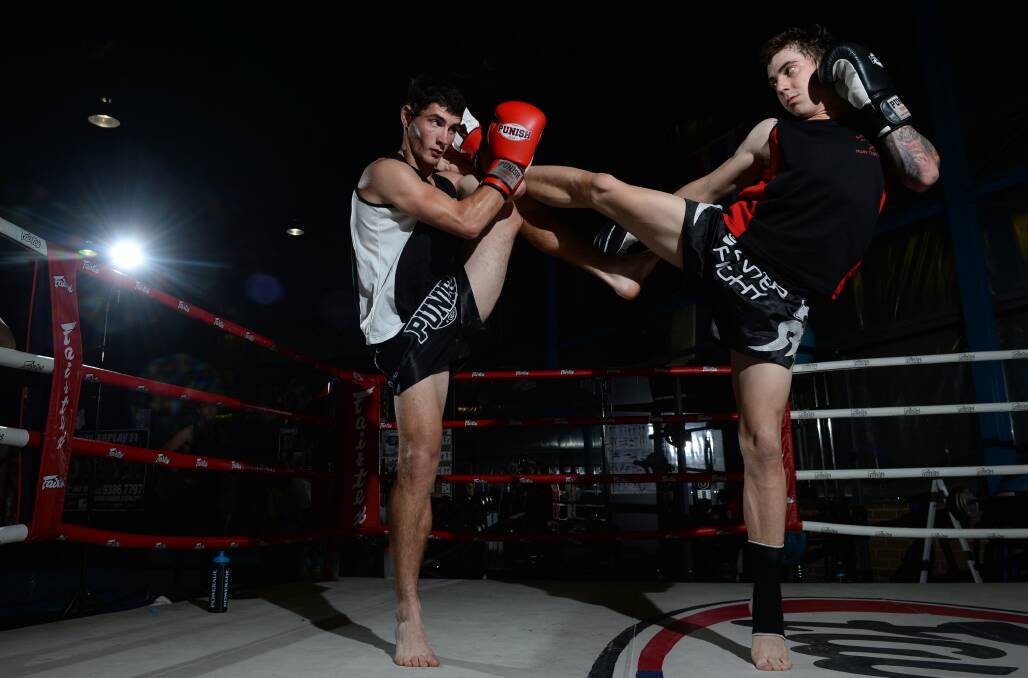 Nick Taylor, left, and Trent Anderson do some sparring before the Gold Rush Fight Night III event.