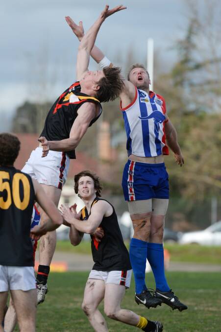 Battle: Bacchus Marsh’s Rhys McNay and East Point captain Paul Koderenko in a ruck contest last year. PICTURE: KATE HEALY