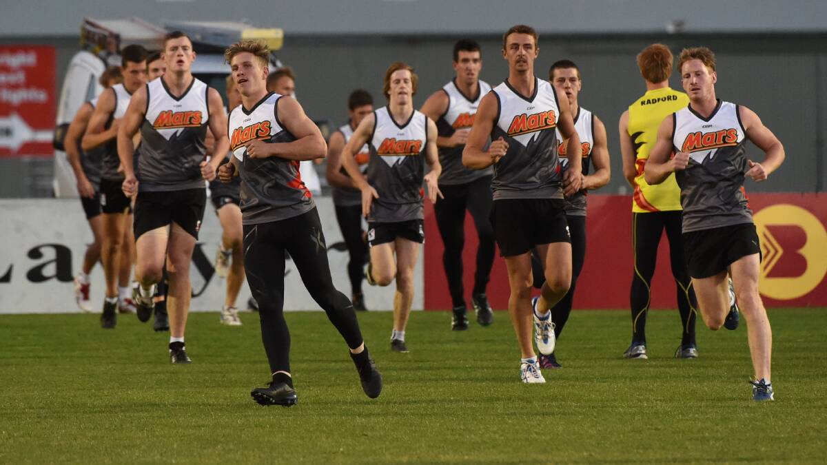 Ready: North Ballarat Roosters at training on Wednesday. PICTURE: LACHLAN BENCE