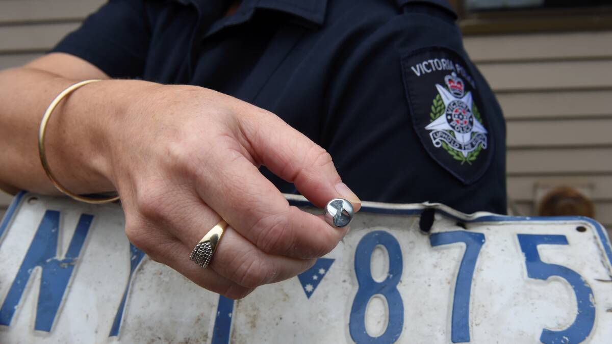 Safer plates: One of the anti-theft number plate screws which will be on offer during Operation Safe Plate Day at the Bunnings store in Creswick Road tomorrow. PICTURE: LACHLAN BENCE