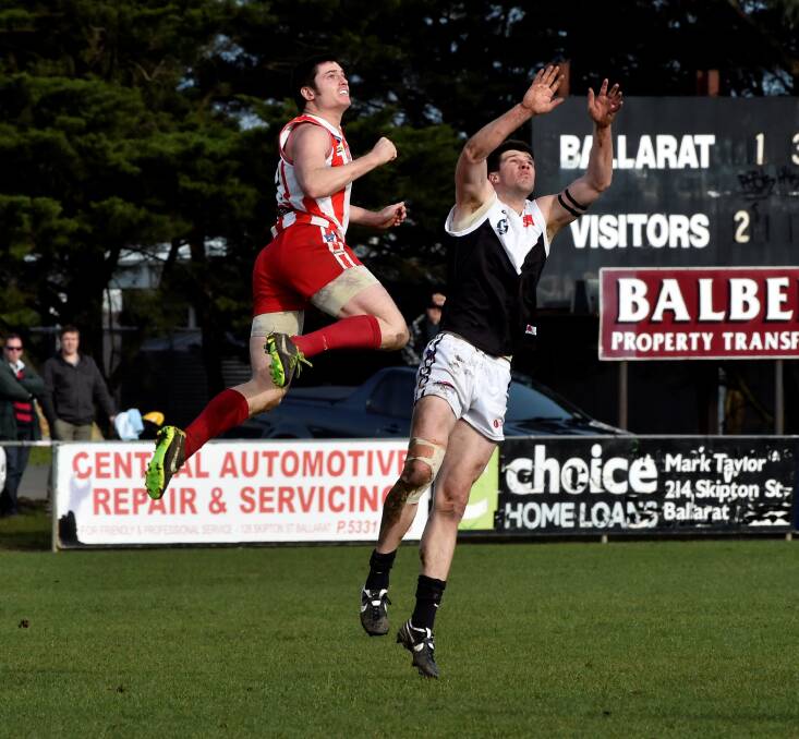 I’M BACK: Ballarat’s Luke Brennan soars above North Ballarat City defender Ryan Hobbs earlier this year. Brennan is a huge inclusion for the Swans this week. 
pICTURE: JEREMY BANNISTER