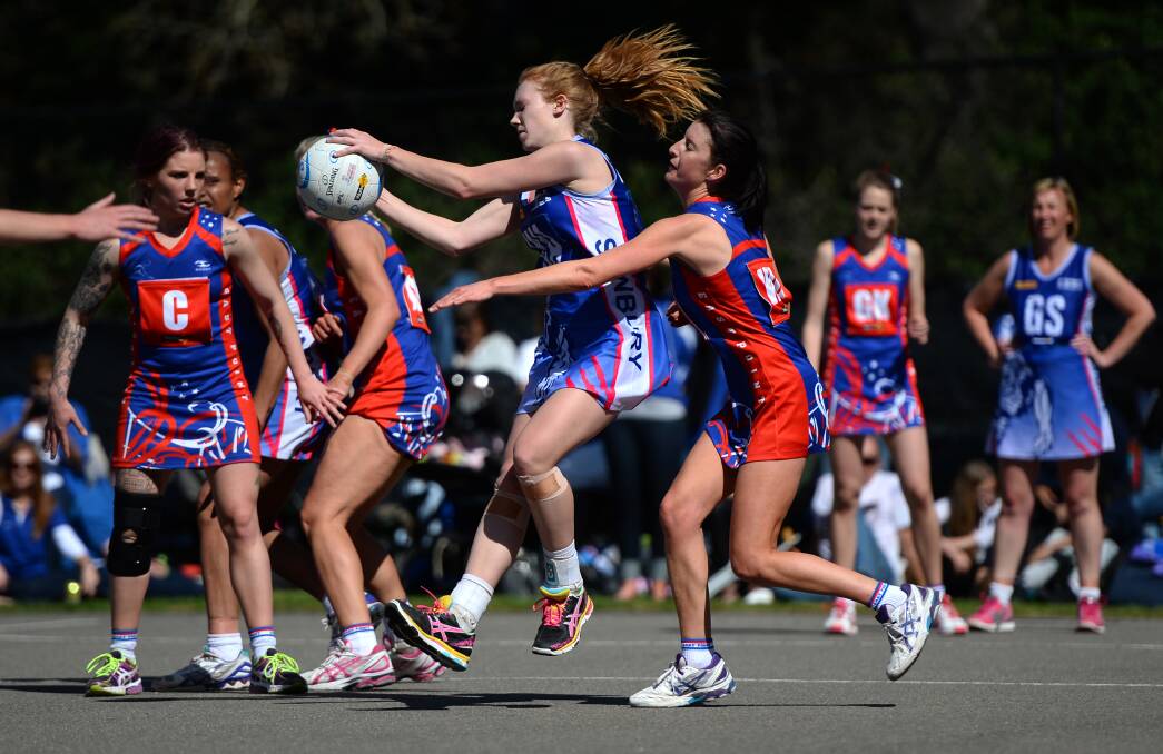 Fierce competition: Sunbury’s Kate Fletcher and East Point’s Merryn Rogan in the heat of the game. PICTURE: ADAM TRAFFORD