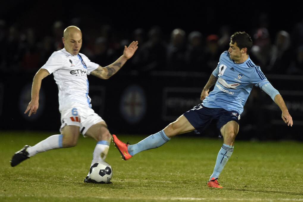  Aaron Mooy of Melbourne City and  Corey Gameiro of Sydney FC do battle. PICTURE: JUSTIN WHITELOCK