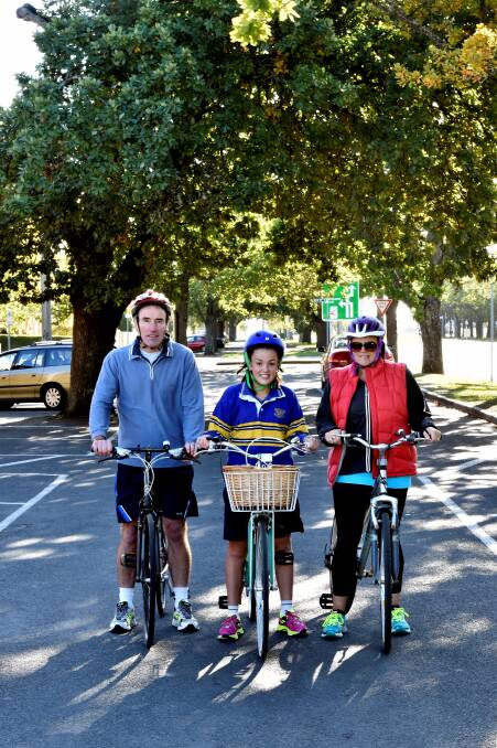 BIKE STRATEGY: Loreto deputy principal Pat O’Shea, with occasional rider Bella Quinlan and her mother Sarah, is rallying to get better bike paths in Ballarat. Mr O’Shea said cycling in Ballarat was very dangerous, and he knew of only two Loreto students who travelled to school on bike. PICTURE: JEREMY BANNISTER
