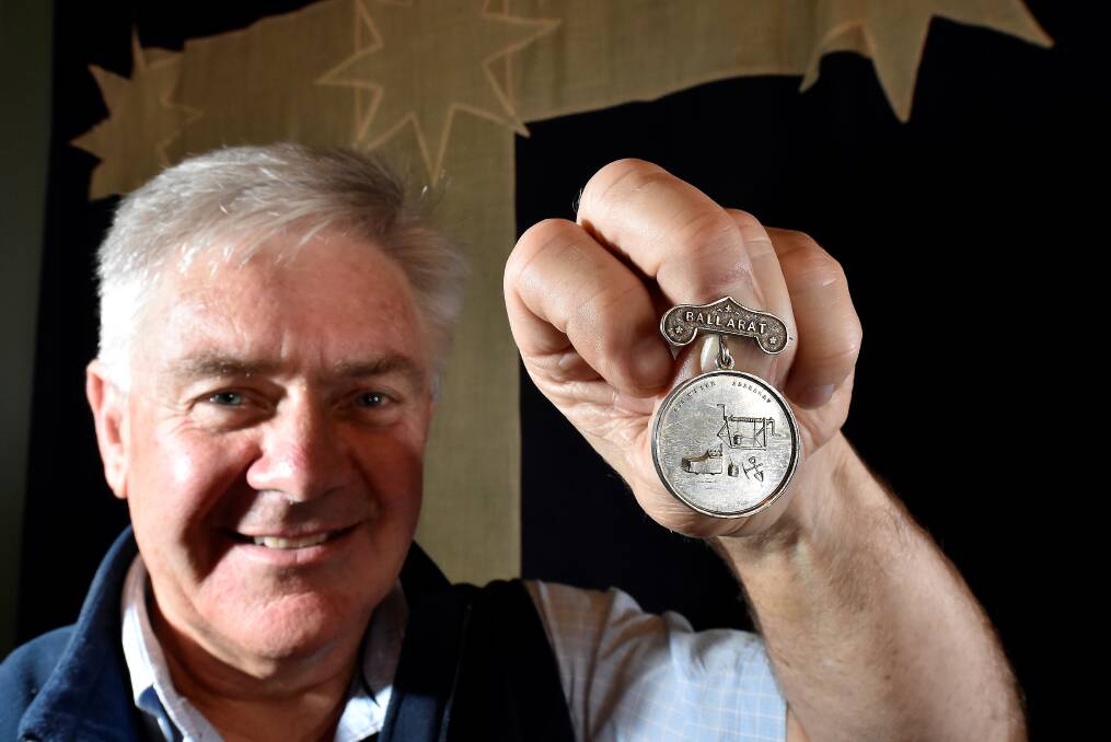 Historic: Old Colonists Club treasurer Andrew Tweedie with the rare medal. PICTURES: JEREMY BANNISTER