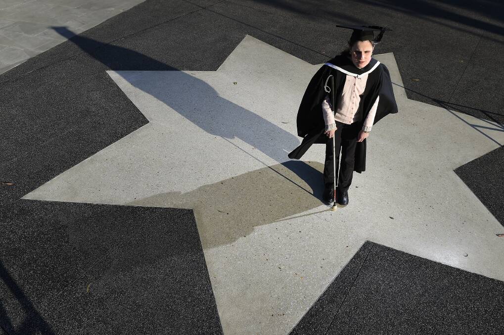 STAR STUDENT: Kristy Moss graduated from Federation University with a Bachelor of Arts on Monday. Ms Moss, who is blind, is one of 1200 students who will graduate this week. PICTURE: JUSTIN WHITELOCK