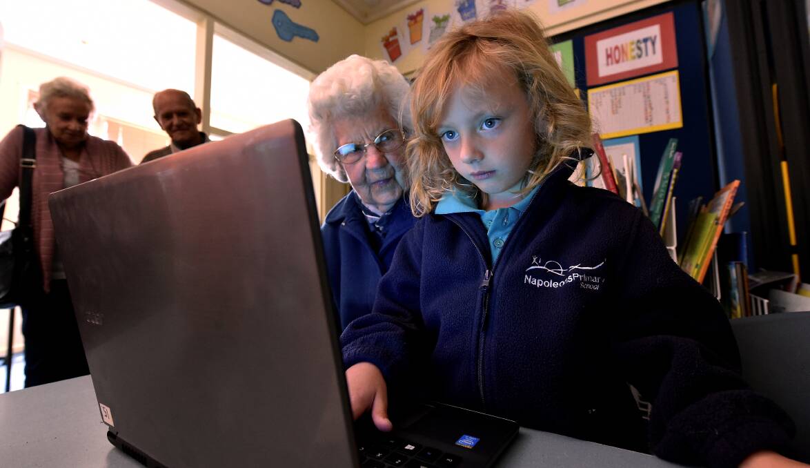 New ways: Prep pupil Lachlan Mewett shows his great-grandmother Dorothy O’Reilly, 101, some of his computer skills during Grandparents Day at Napoleons Primary School on Wednesday. PICTURE: JEREMY BANNISTER