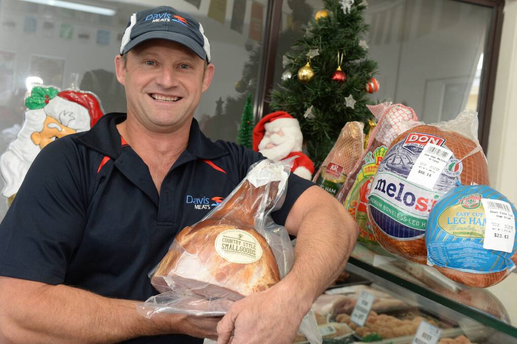 Variety: Colin Bilney, of Davis Wholesale Meats in Redan, says he stocks a number of different products that will help make your meal delicious. PICTURE: KATE HEALY