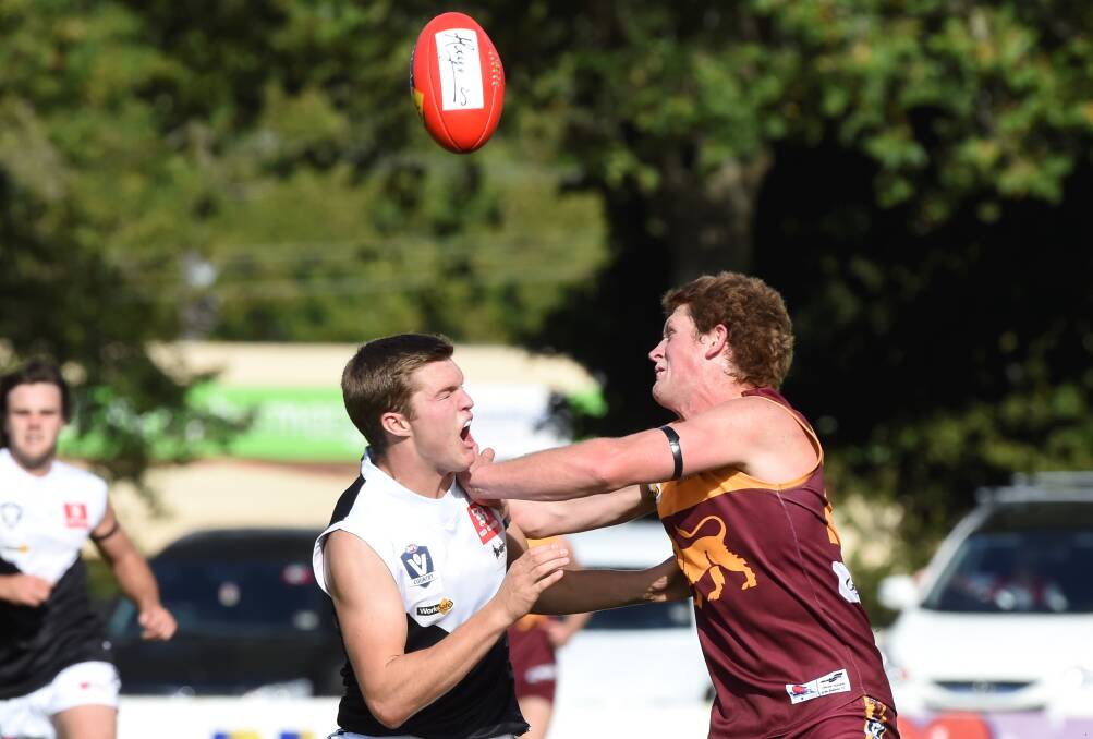 Testing: North Ballarat City’s Mitchell Johns (who comes back in this week) and Redan’s Aaron Hepworth fight hard for the ball in round one.
Picture: Lachlan Bence