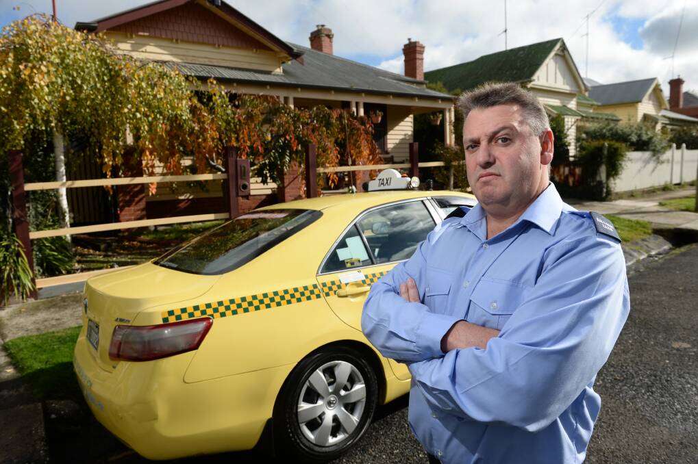 Fuel costs up: Taxi driver Scott Parker expects to be hit hard by the federal budget.
