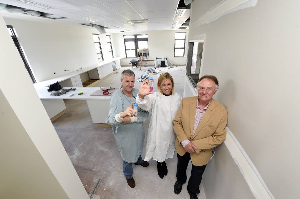 New home: Scientists Brendan Toohey and Jenee Mitchell with institute board chairman Professor Wayne Robinson at the new Fiona Elsey Cancer Research Institute building. PICTURE: JUSTIN WHITELOCK