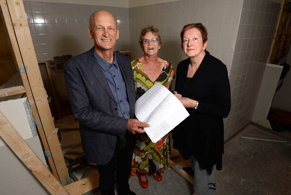 Checking the plans: Ballaarat Mechanics Institute board members Andrew Miller, Fiona Watson and BMI president Ann Cato inspect work on the new kitchen.