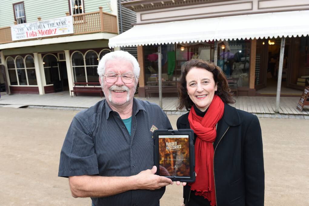 Digital tour: Uncle Bryon Powell and Sovereign Hill board president Jane Cowles show off the new app. PICTURE: LACHLAN BENCE
