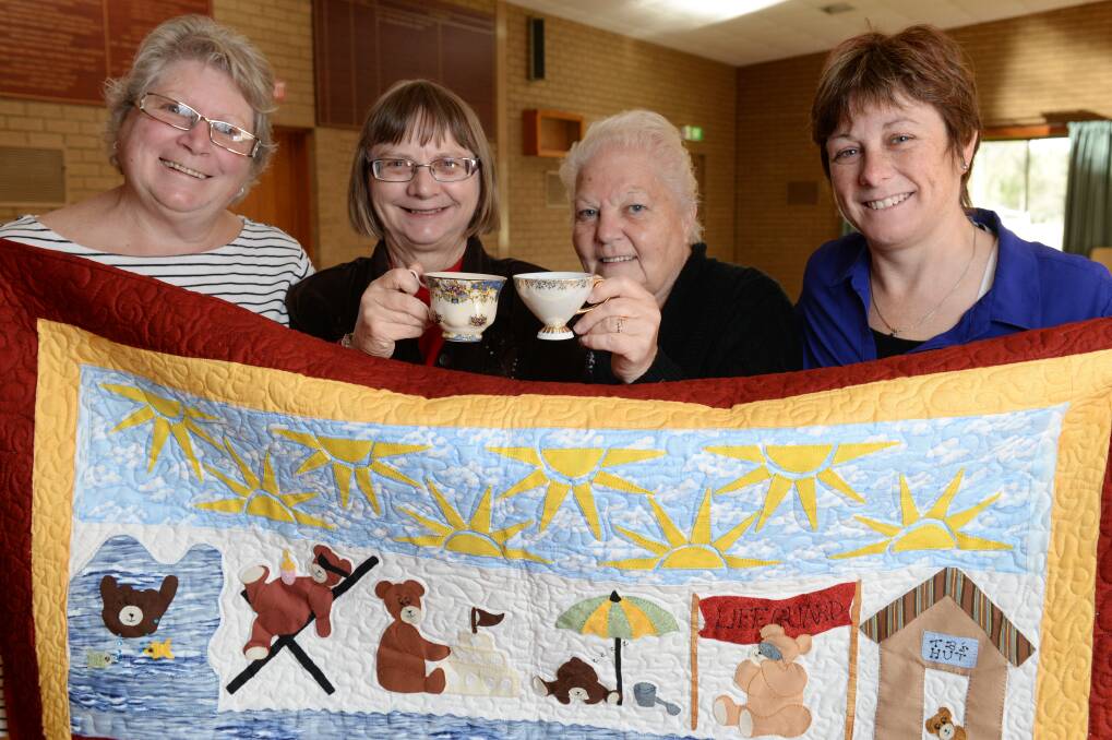 Fundraiser: Lee Smith, Dianne Eden, Jenny Cody and Sue Martin will raffle a quilt as part of the TOPIC group’s annual Biggest Morning Tea. PICTURE: KATE HEALY