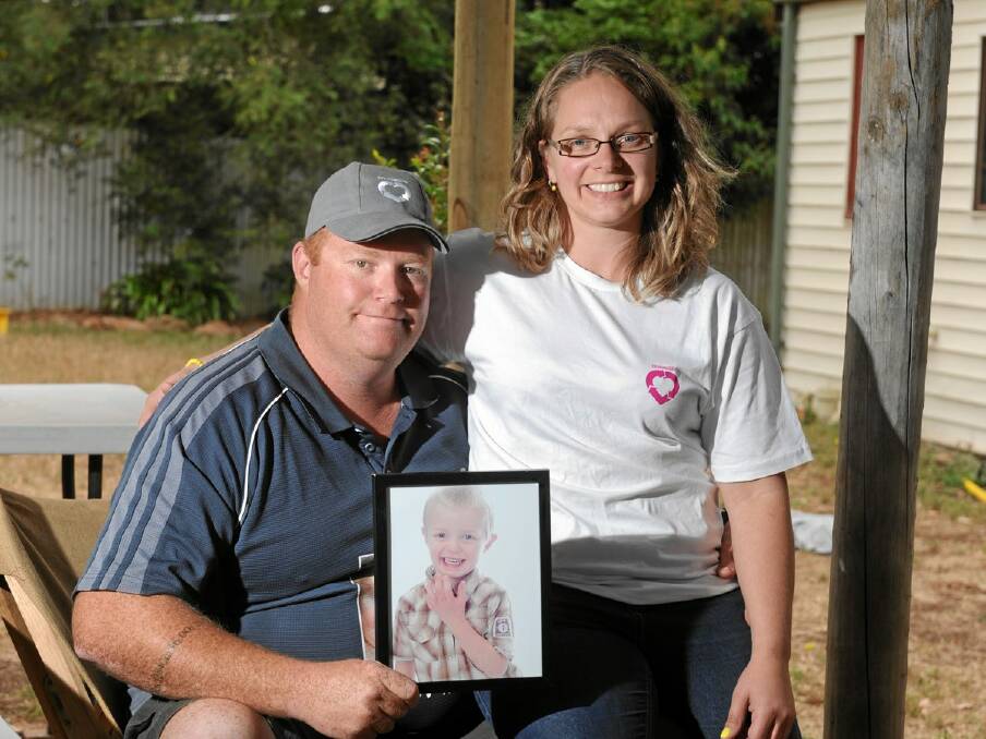 Legacy: Jon and Michelle Seccull with a picture of Ethan.