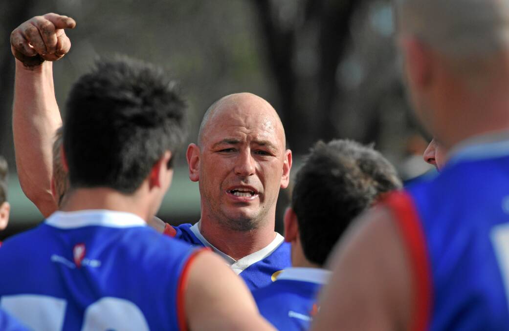 Making a point: Daylesford coach Joel Adams addresses his troops during a break in play. Picture: JULIE HOUGH