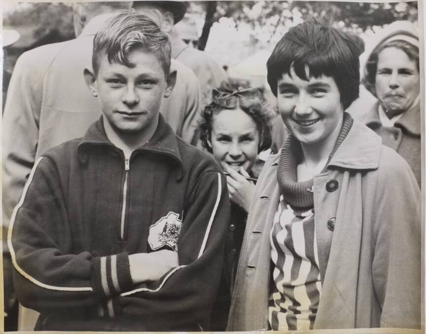 SEARCH: 1956 Australian Olympian John Jenkinson with the girl he is looking for, and her mother, on the right. 