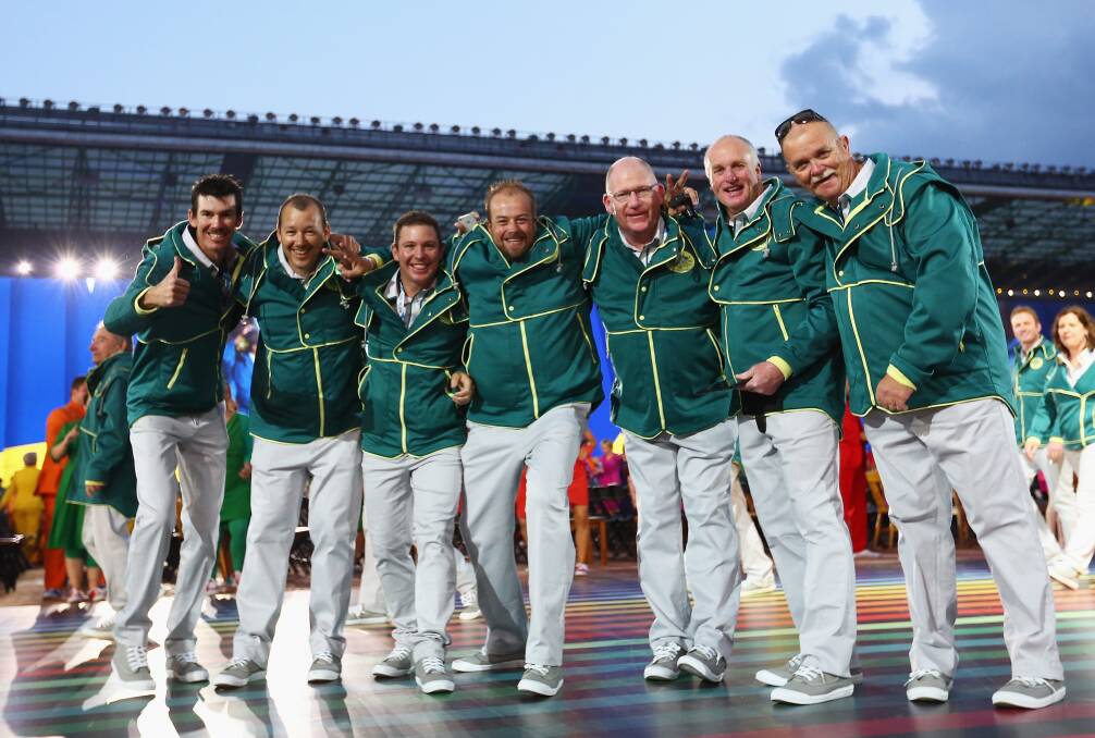 WORLD STAGE: Matt Flapper (centre) and other members of the Australian lawn bowls team join in the fun at the Commonwealth Games opening ceremony. Another former Ballarat player Brett Wilkie is second from the left. 
PICTURE: Getty Images
