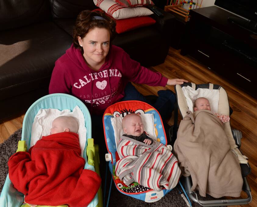 Michelle Bowler with  triplets Amelia, Jacob and Molly Markovic-Bowler. PICTURE: KATE HEALY