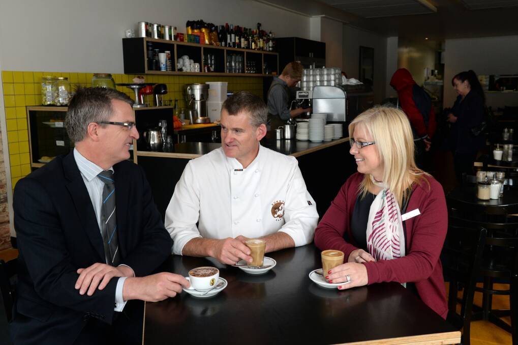 Retail strategy: Bendigo Bank Ballarat Central branch manager Leigh Cassidy, Europa Cafe owner Adam Rasmussen and Bendigo Bank Wendouree Branch customer relations officer Julie Robbins meet at Europa Cafe to discuss small business in Ballarat as part of the Support Small Business Day campaign. PICTURE: KATE HEALY