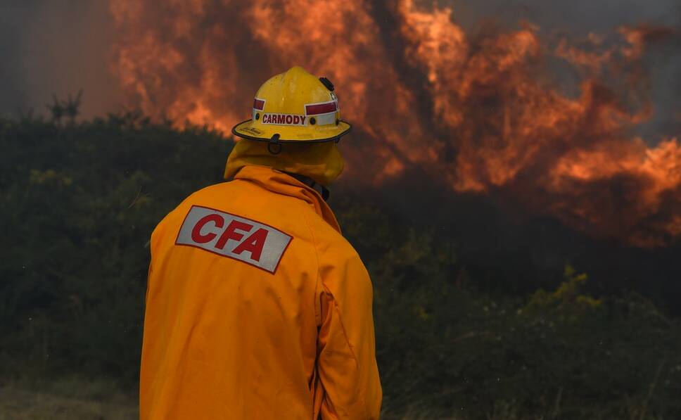Leading Firefighter John Carmody at he bushfire on Saturday which burnt into the night. Picture: Justin Whitelock.
