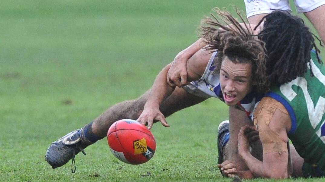 LOCKED IN: Sunbury's Mitch Conn and Lake Wendouree's Andrew Ciavarella compete for the ball.